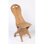 An early 20th century French rustic pine country chair, solid back & seat, X-frame legs, 88cm high.