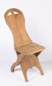 An early 20th century French rustic pine country chair, solid back & seat, X-frame legs, 88cm high.