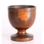 A 19th Century English laburnum treen salt, the dumpy bowl on turned stem to circular footed base,