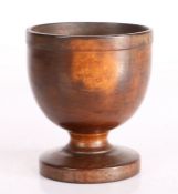 A 19th Century English laburnum treen salt, the dumpy bowl on turned stem to circular footed base,