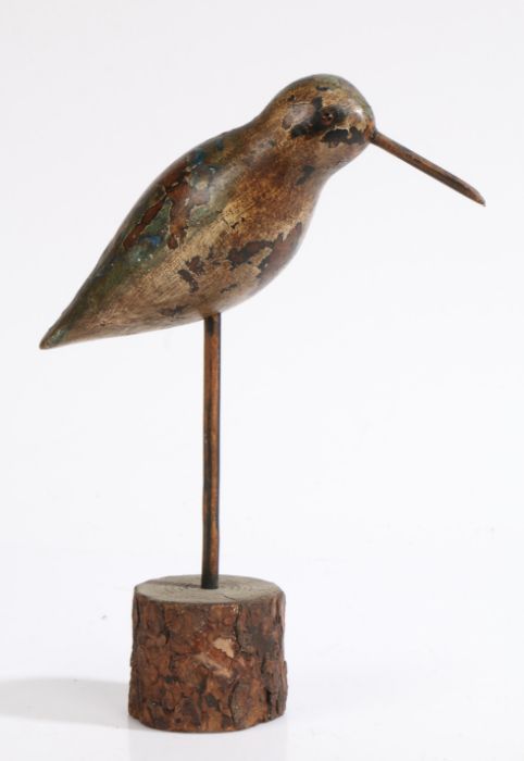 A 19th century wooden decoy bird, elongated beak, glass eyes, mottled handpainted finish, some