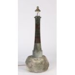 A 20th century Cornish serpentine marble lighthouse lamp, on rock base, 84cm high.