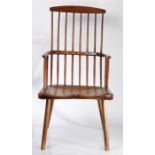A good primitive 19th century stick-back Windsor chair, elm-seated, turned supports, 118cm high.