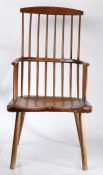 A good primitive 19th century stick-back Windsor chair, elm-seated, turned supports, 118cm high.