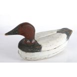 An early 20th century American wooden decoy duck, painted black, brown & white, 38cm long,16cm