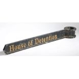 A 20th century English black & gold painted cast metal direction sign, 'House of Detention',