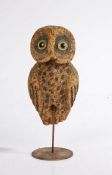 An early 20th century Folk Art cork decoy owl, with glass eyes, charred markings, associated