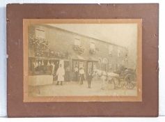 Large original late Victorian / Edwardian sepia photograph of a butchers’ shop situated amongst a