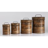 A set of four late 19th century graduated toleware kitchen tins, of cylindrical form, with