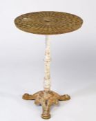 A composite occasional table, the 20th century drain cover circular top on Victorian cast iron base,