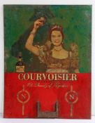 Courvoisier Cognac painted advertising sign, depicting a lady hold aloft a glass of Courvoisier, tin