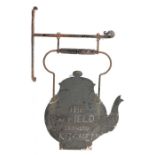 A 19th century Folk Art hanging painted-metal tea shop sign, kettle-shaped form, turned wooden