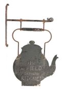 A 19th century Folk Art hanging painted-metal tea shop sign, kettle-shaped form, turned wooden