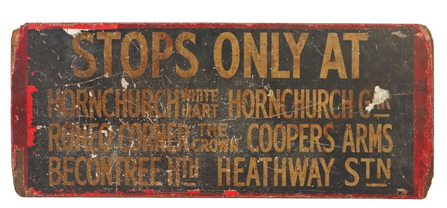 An early 20th century plywood transport sign, printed with 'STOPS ONLY AT HORNCHURCH...etc' double-