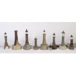 Eight 20th century Cornish serpentine marble lighthouse lamps, various sizes, some losses (8)
