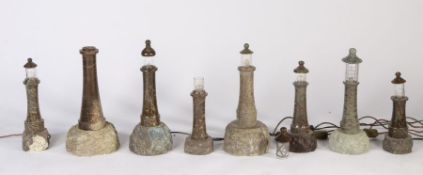 Eight 20th century Cornish serpentine marble lighthouse lamps, various sizes, some losses (8)