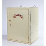 An early/mid 20th Century lockable toleware shop or kitchen advertising cake cupboard, painted in