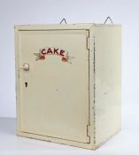 An early/mid 20th Century lockable toleware shop or kitchen advertising cake cupboard, painted in