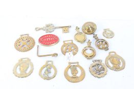 Collection of brass items, to include horse brasses, a large key, Blisworth Tunnel plaque etc. (