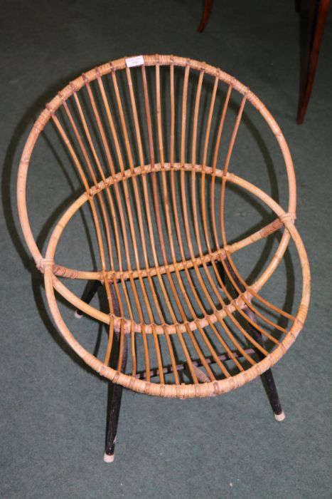 20th century wicker tub chair raised on a black metal frame, 73cm high