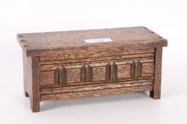 Novelty musical jewellery box,in the form of an oak coffer, 19cm wide