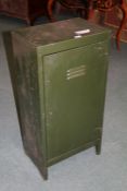 A green painted metal locker, with a single door opening to reveal a single shelf, 92cm high 46cm