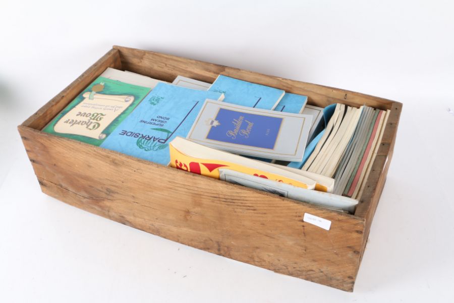 Wooden crate containing unused notebooks