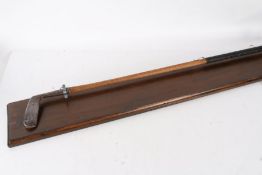 A W. J Rush of Cromer Gem Putter Special, mounted on a wooden plaque, 98cm wide