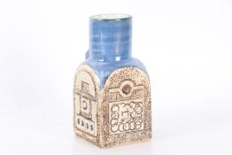 Troika pottery spice jar, having blue glazed neck and rough textured pattern, signed Troika with