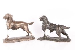 Two bronzed models of dogs, one of a golden terrier and the other of a Springer Spaniel, the largest