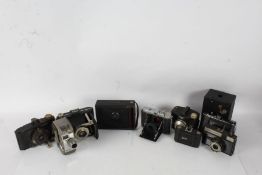 A collection of 20th century cameras and lenses to include Agfa, Cosmic, Zeiss Ikon etc (Qty)