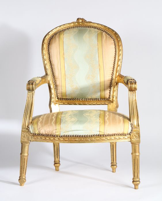 Continental gilt wood armchair the arched back with pad back above a stuff over seat flanked by