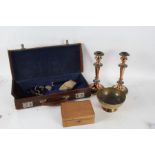 A collection of works of art to include a leather case, pair of copper candle sticks, brass bowl etc