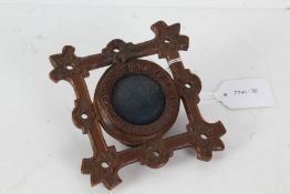 Victorian carved treen pocket watch stand, the square border with pierced holes and flower head