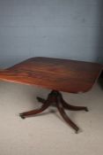 19th century mahogany breakfast table, the associated top raised on four reeded out swept legs and