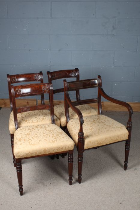 Three 19th century mahogany bar back dining chairs, and a carver chair similar (4)