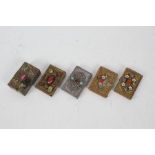 Five 20th century brass card cases, all set with various stones and decorated with an embossed