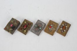 Five 20th century brass card cases, all set with various stones and decorated with an embossed