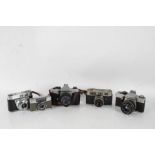 Five 20th century cameras and lenses to include a Praktica Super TL2 with a Pentacon auto 1.8/50