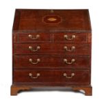George III oak and inlaid bureau, the slopping fall with shell inlaid enclosing a series of