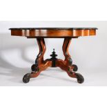 Early 20th Century French walnut extending dining table, the shaped top with ebonised border, raised