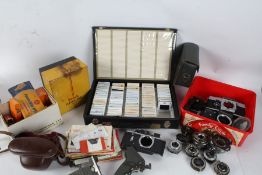 A large collection of various camera parts and accessory's to include Zenit TTL camera body and a