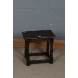 A 19th century oak joint stool, the rectangular top above tapering legs and stretchers, 46cm high