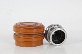 A Schneider Kreuznach Jsogon 1:4,5/40 lens 3058506 housed within a wooden case