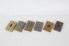 Five 20th century brass card cases together with an Aide memoir all set with various stones and