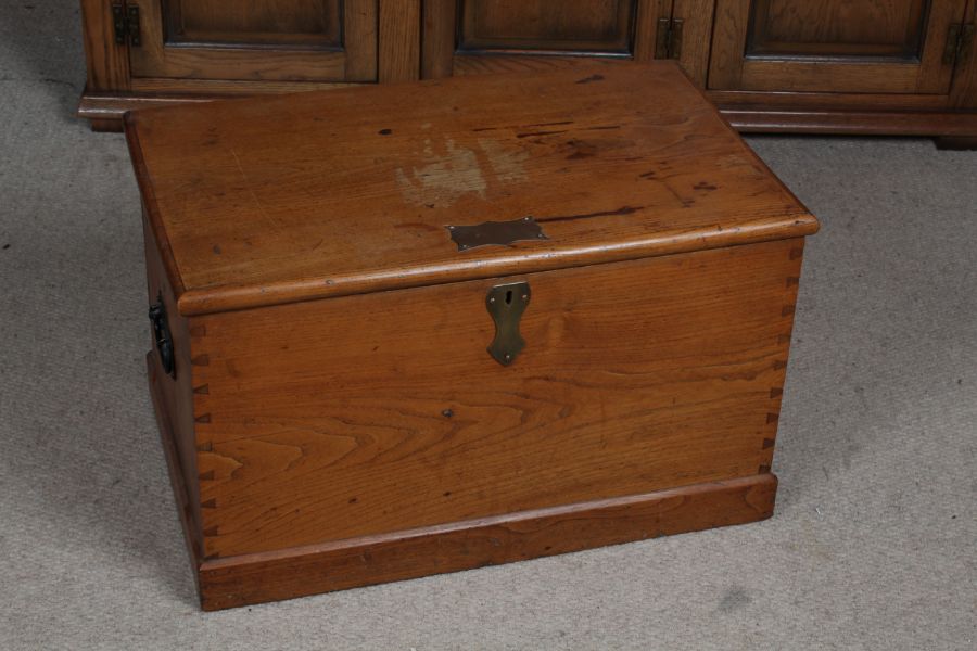 Victorian pine blanket box, the hinged lid with brass cartouche, with iron carrying handles, 63cm
