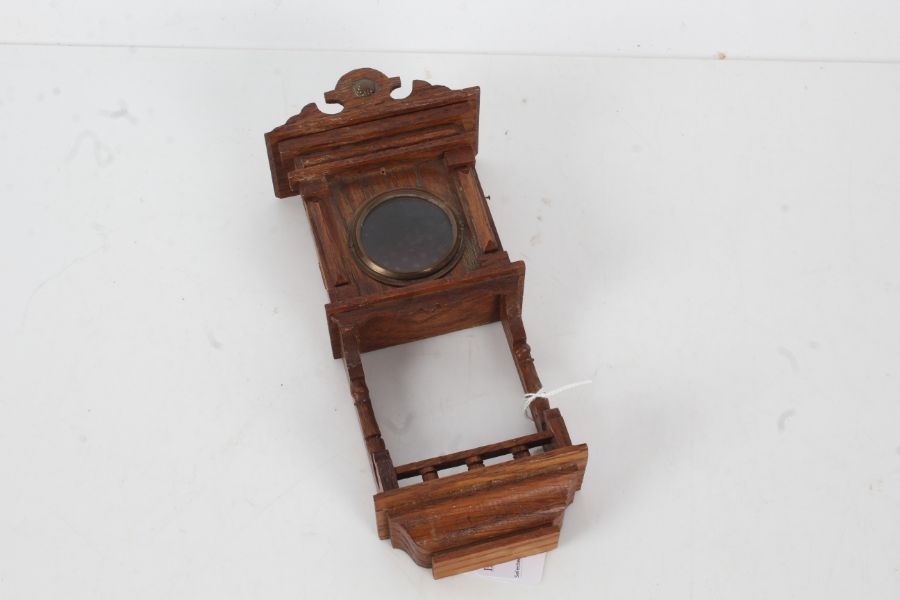 Novelty oak pocket watch holder, in the form of a clock case, with glazed panel, 21.5cm tall