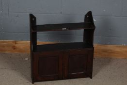 A 19th century mahogany hanging wall cupboard, with a shelf to the top above a pair of cupboard