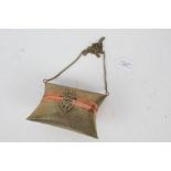 Indian copper and textured brass purse, of pillow form, with chain, 15cm wide
