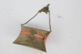 Indian copper and textured brass purse, of pillow form, with chain, 15cm wide